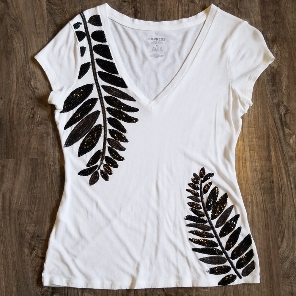 White short sleeve shirt w/black embellishments